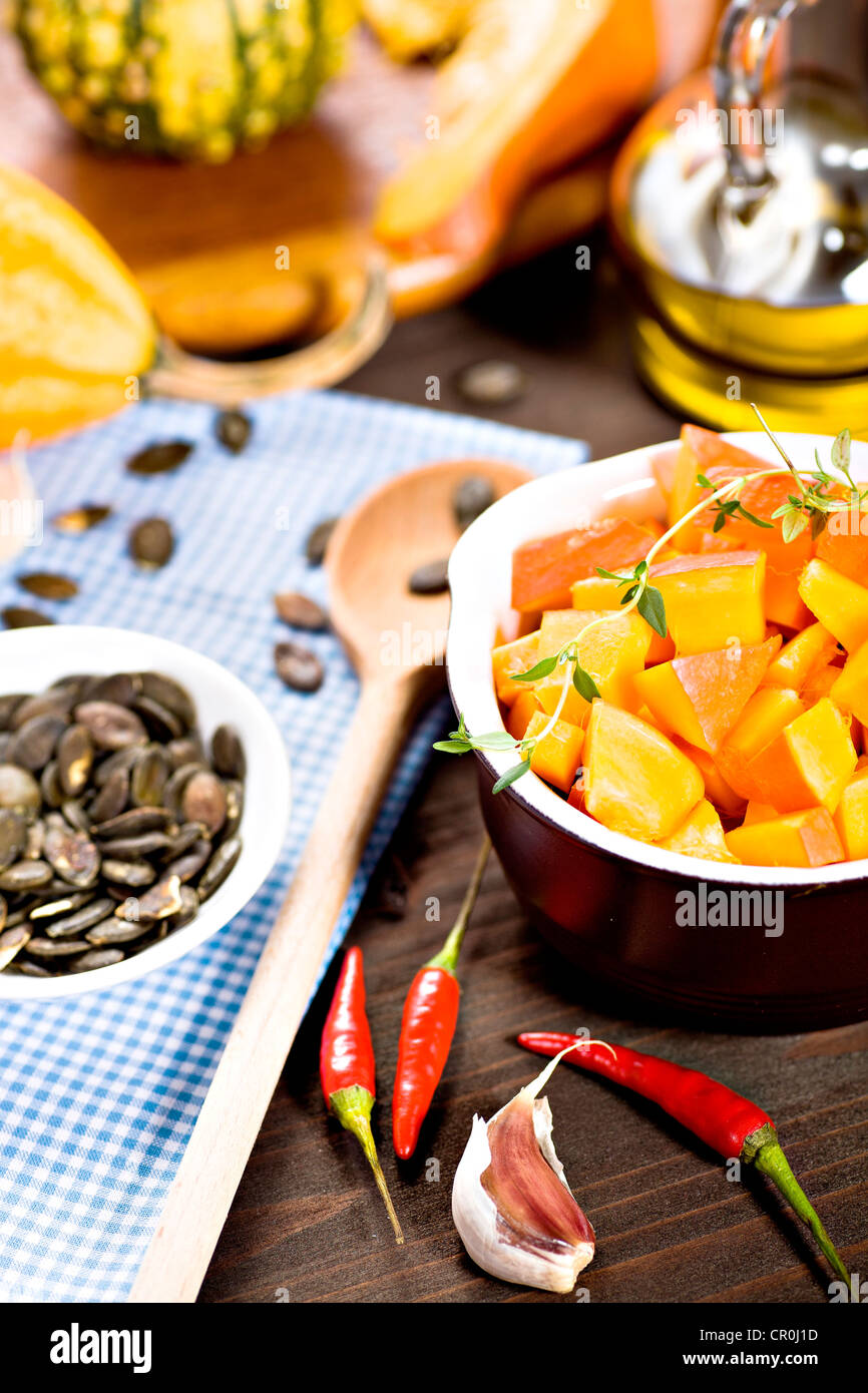 Diced pumpkin, pumpkin seeds, chilis, garlic, oil Stock Photo