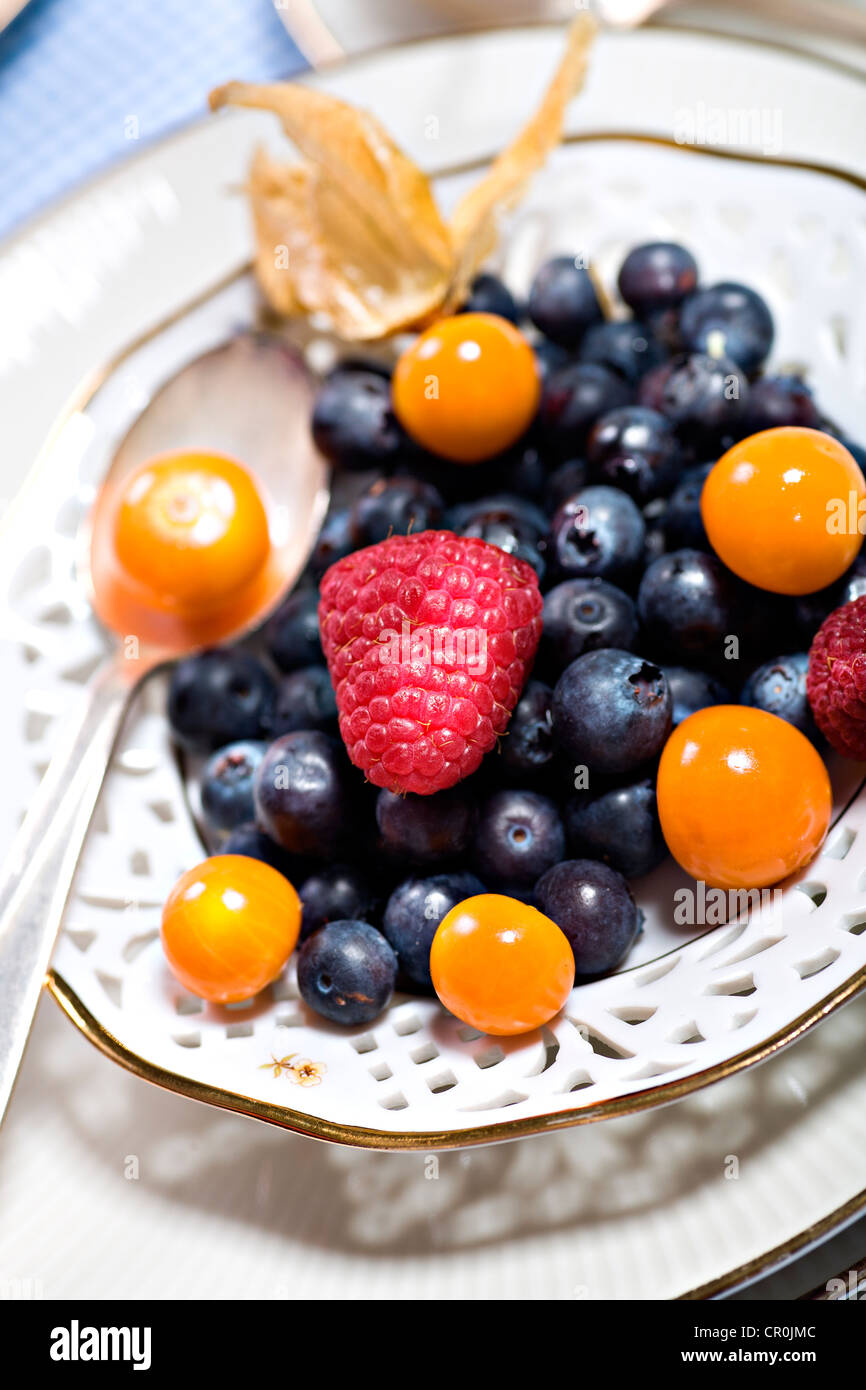 Mixed berries on a plate Stock Photo