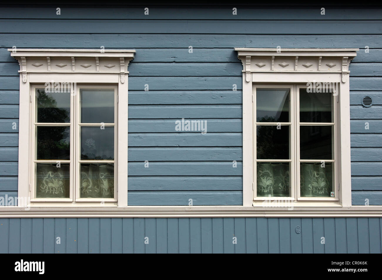 Two windows of a Finnish log cabin in the old town of Porvoo, Finland, Europe Stock Photo