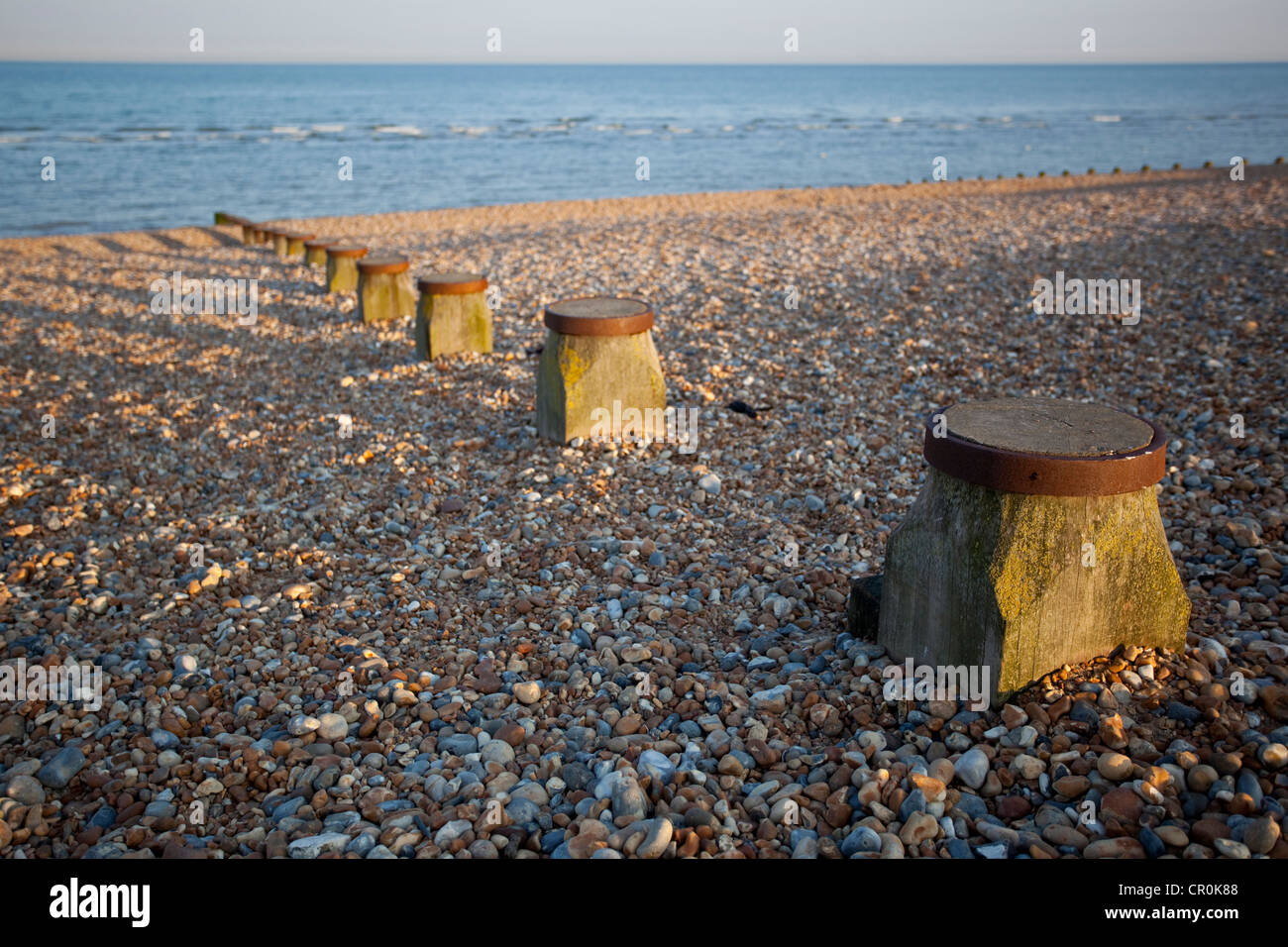 Groynes and pebble beach, Hastings, East Sussex, England, UK Stock Photo