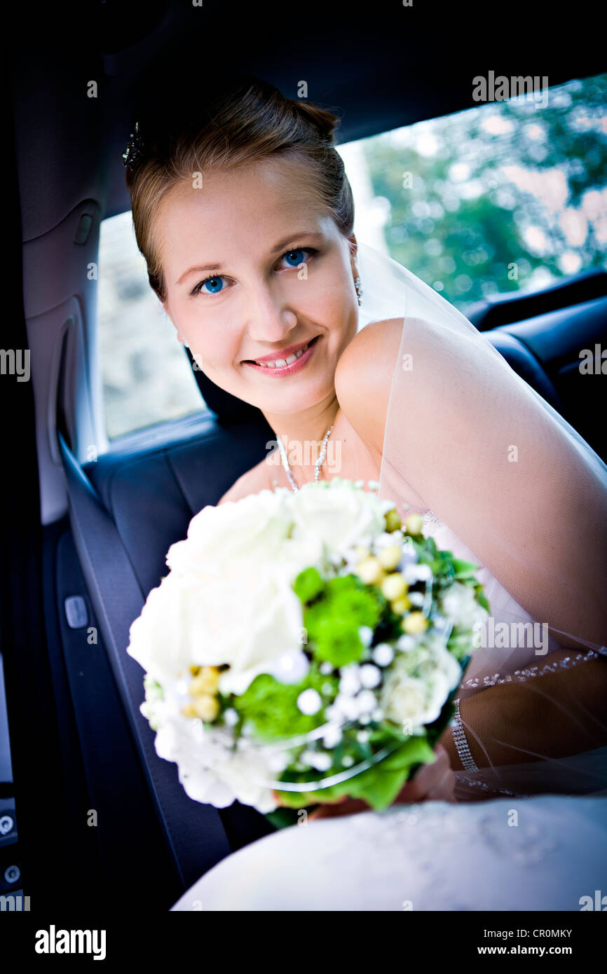 Young bride in the car Stock Photo