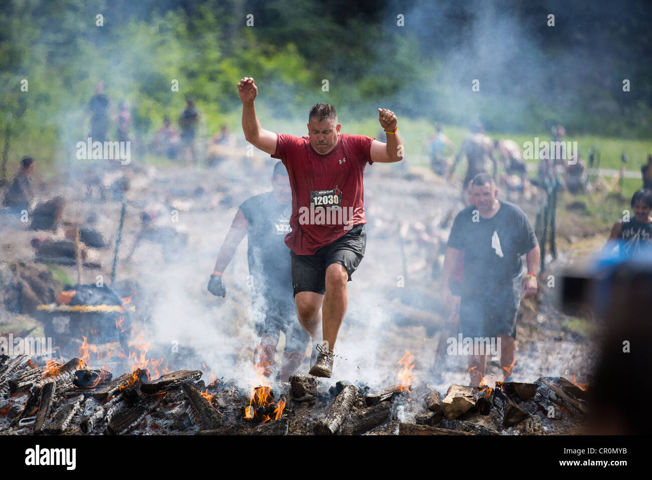 Participants of challenging sprint obstacle trail race, Spartan Race in Tuxedo New York, running