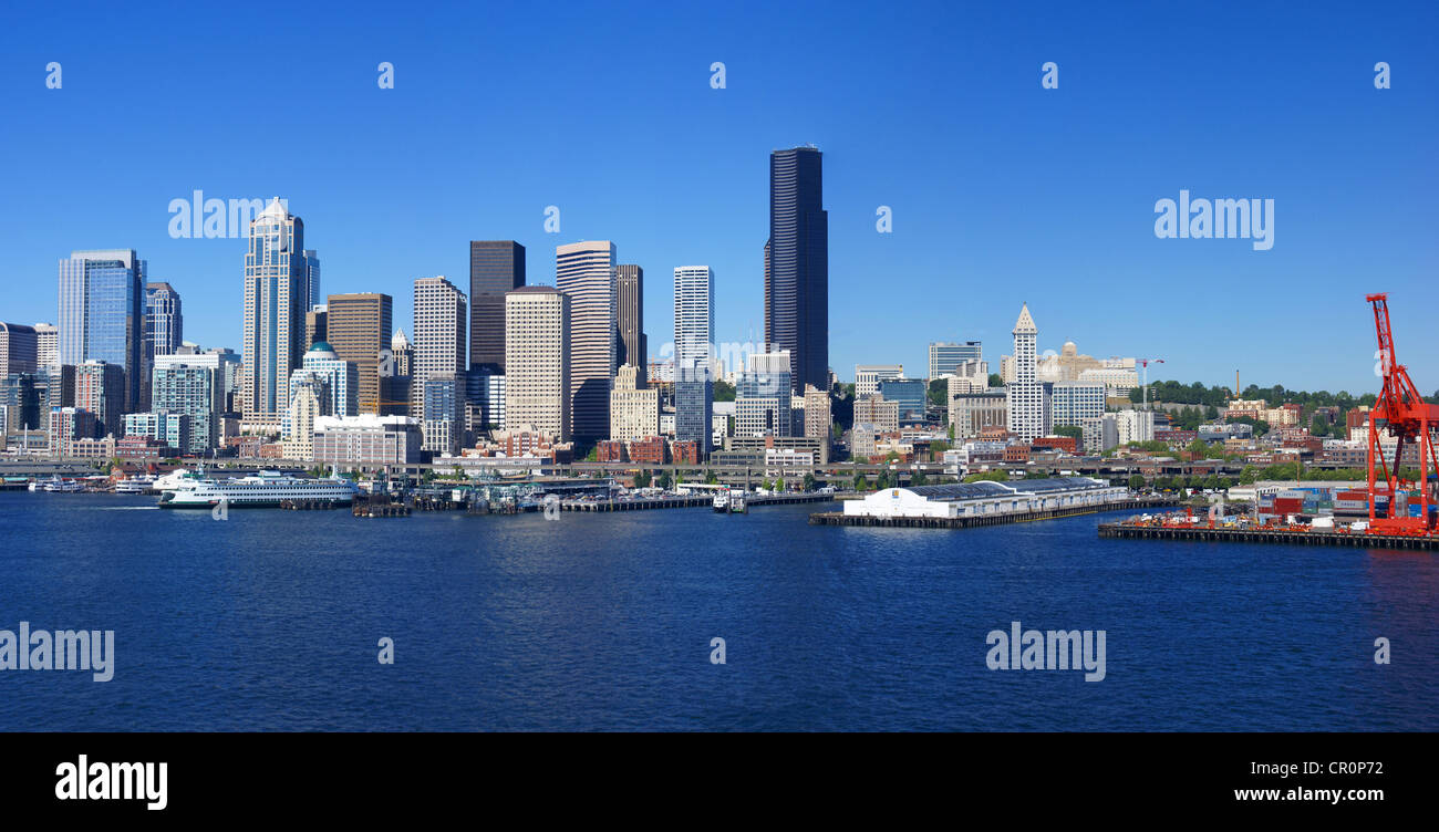 Panorama Seattle waterfront skyline,with ferry and dockyard cranes