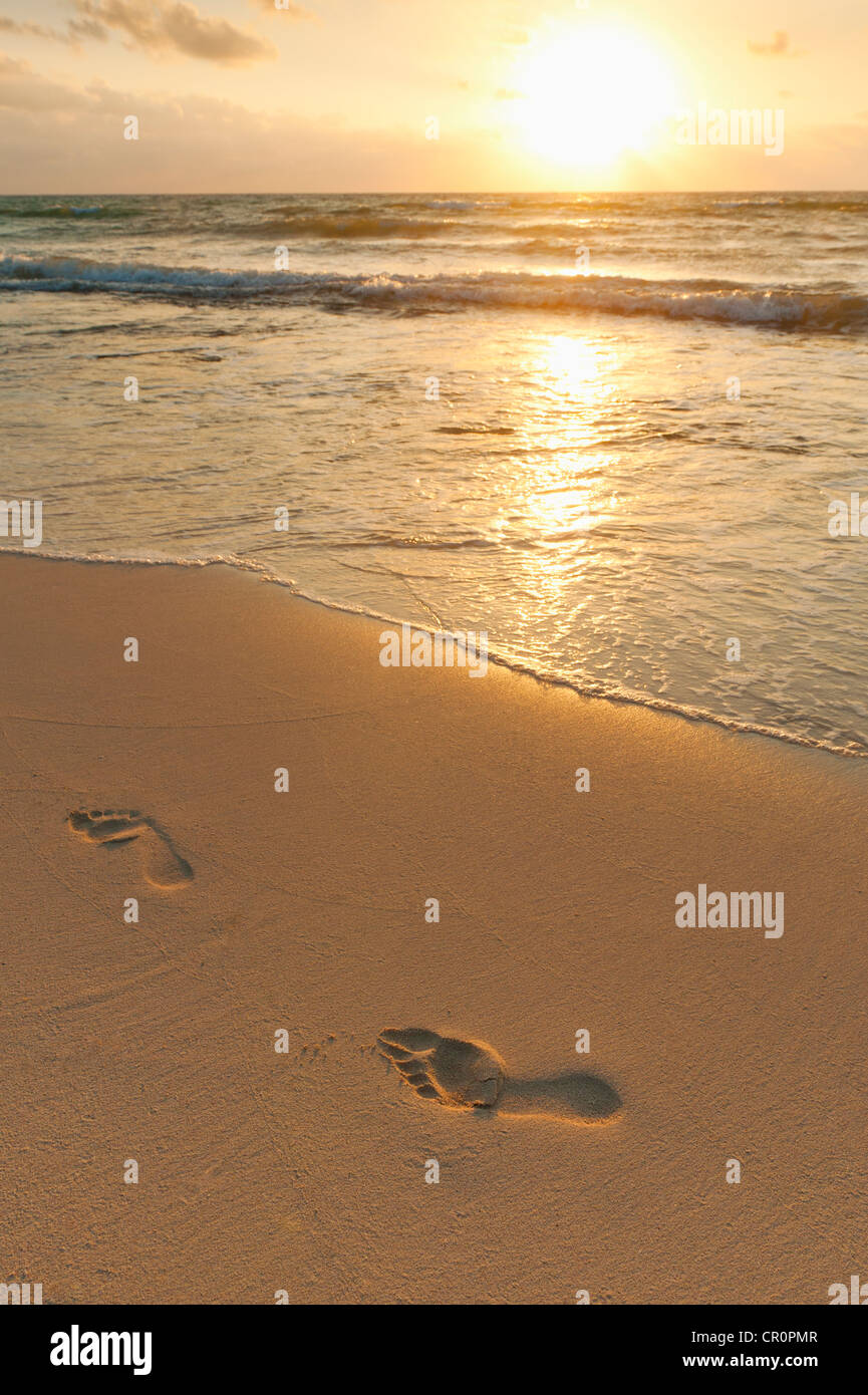 Mexico, Yucatan, Footprints on beach at sunset Stock Photo