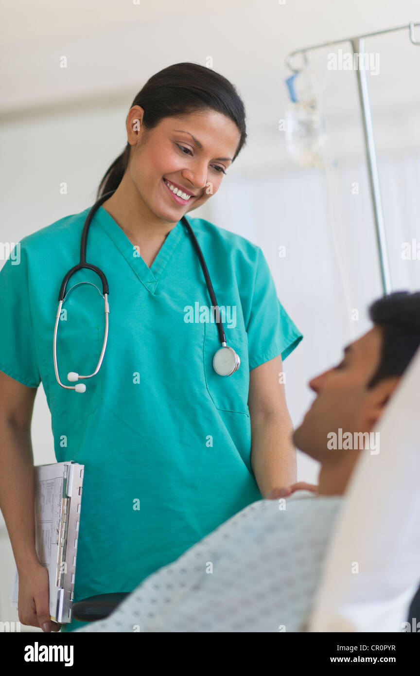 Doctor patient hospital gown hi-res stock photography and images - Alamy