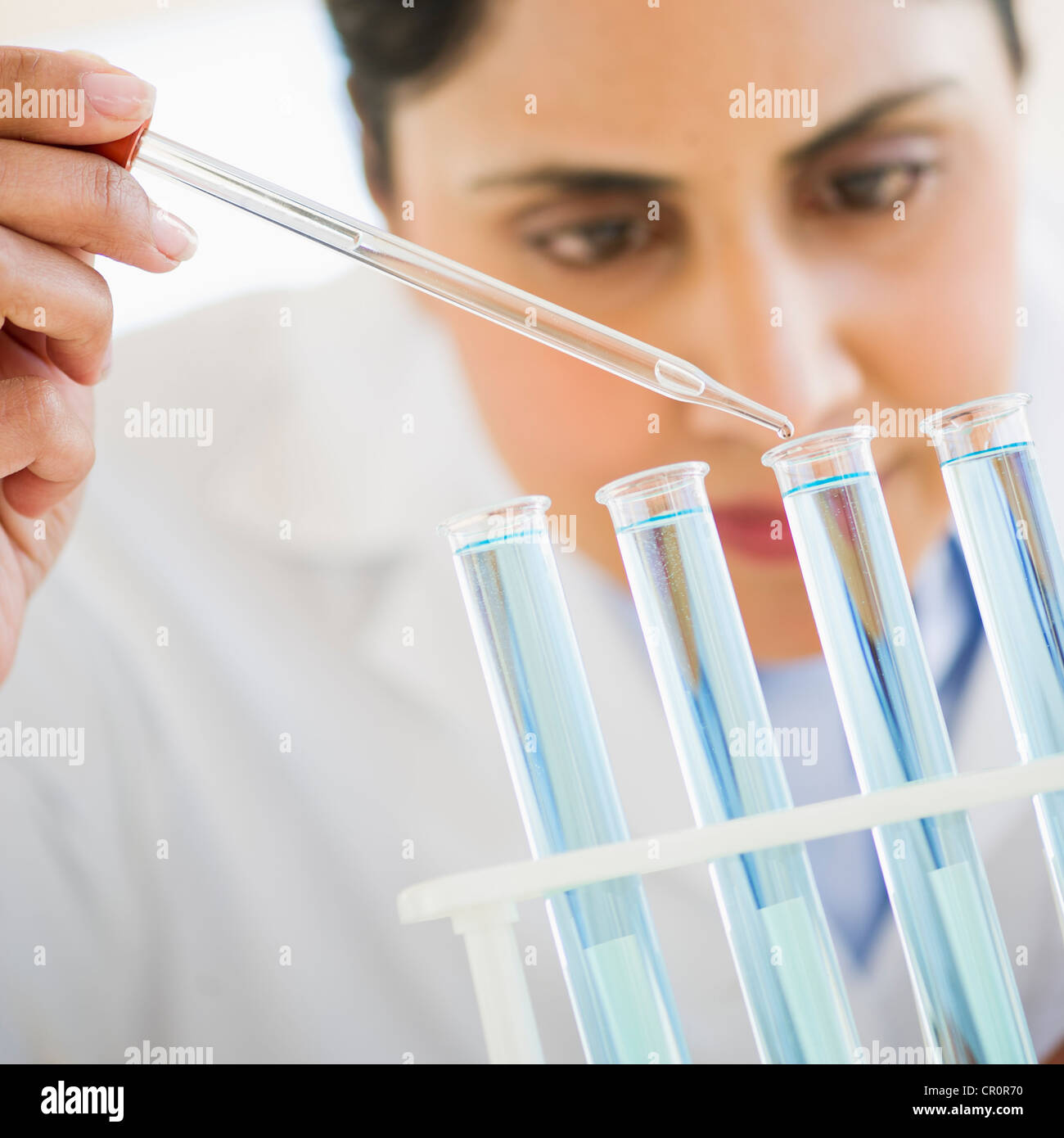 USA, New Jersey, Jersey City, Scientist pipetting liquid into test tubes Stock Photo