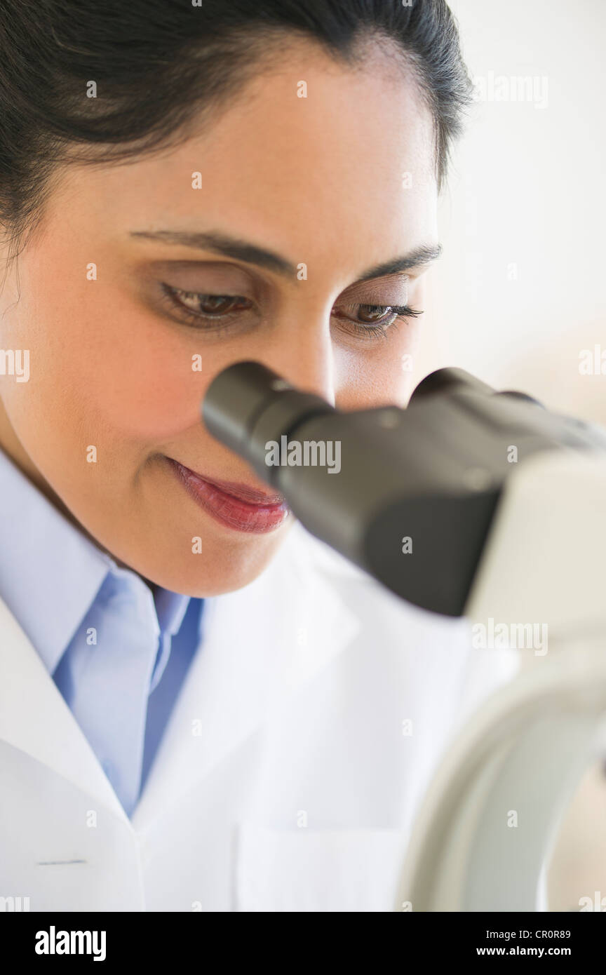 USA, New Jersey, Jersey City, Scientist looking through microscope Stock Photo
