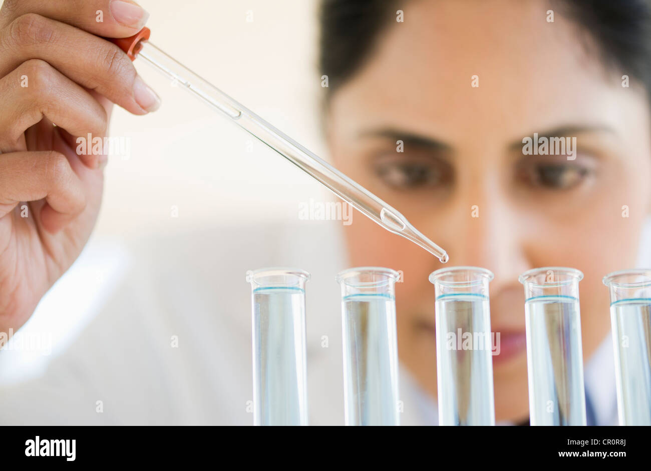 USA, New Jersey, Jersey City, Scientist pipetting liquid into test tubes Stock Photo
