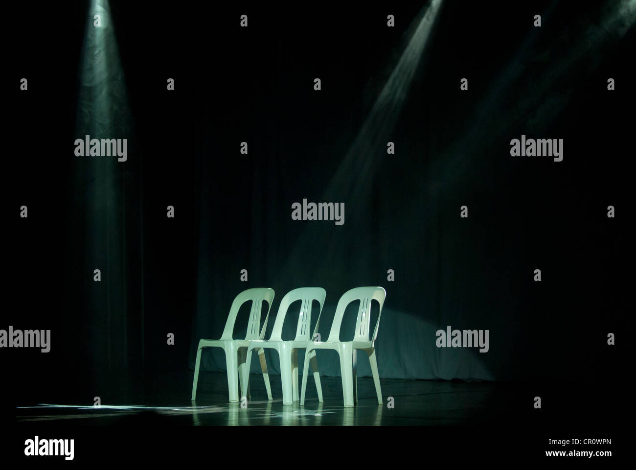 Chairs stand under spotlights waiting for the start of the show as part of The Dreaming at the Woodford Folk Festival. Stock Photo