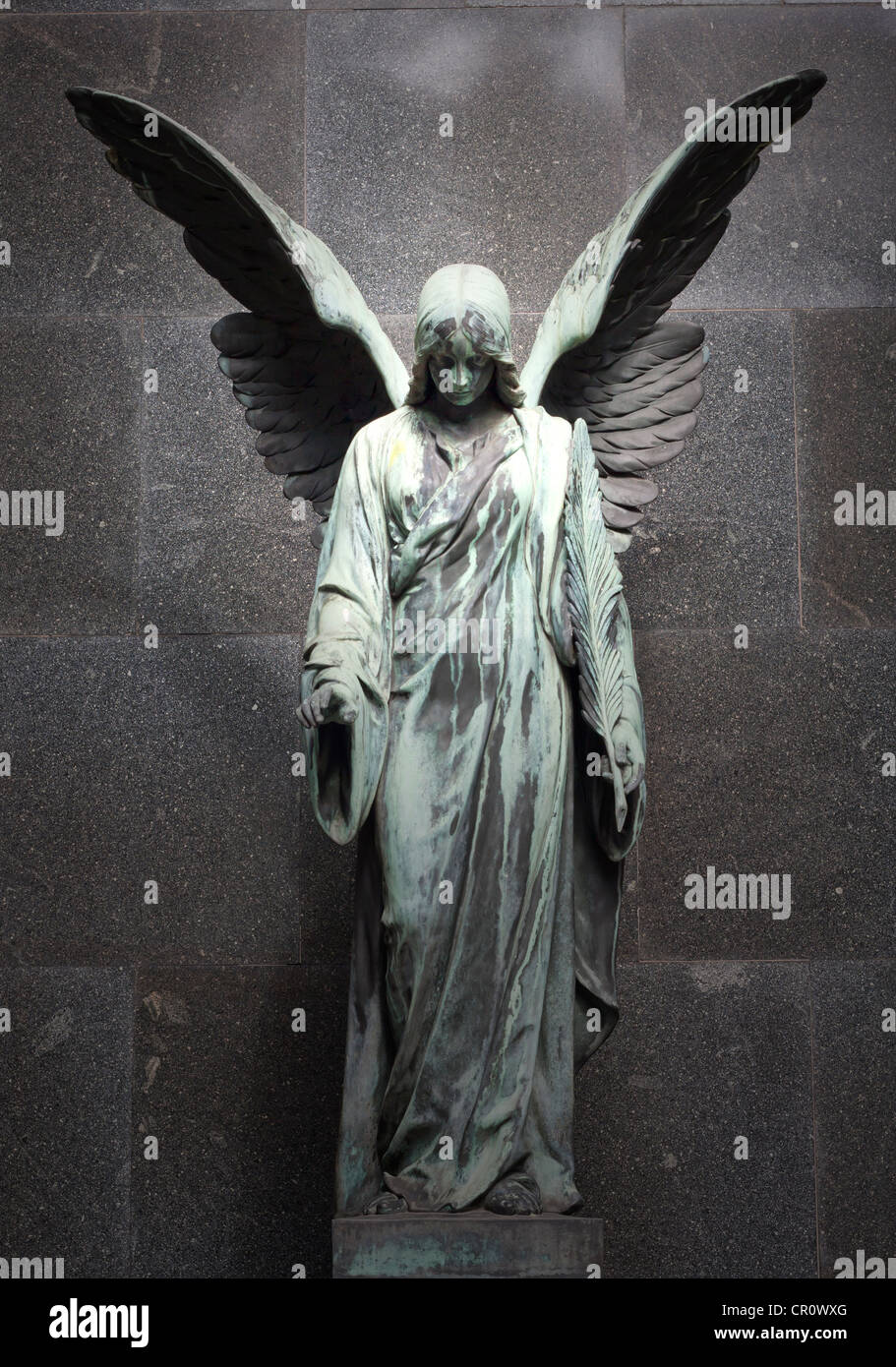 Statue of angel with wings on cemetery Stock Photo