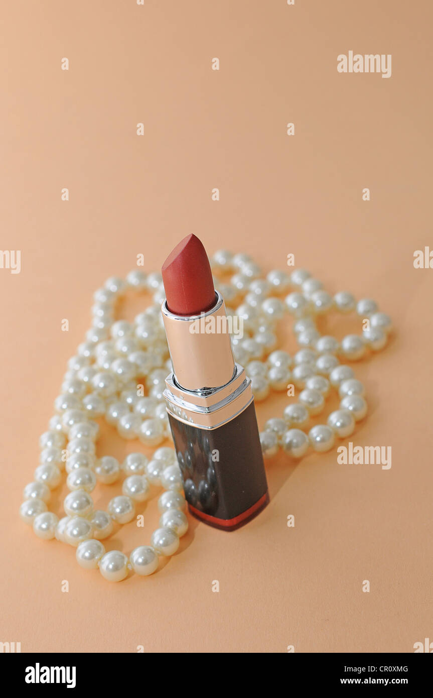 Lipstick with a pearl necklace Stock Photo Alamy
