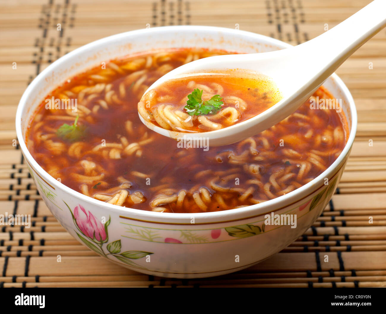 Chinese instant soup and spoon closeup Stock Photo