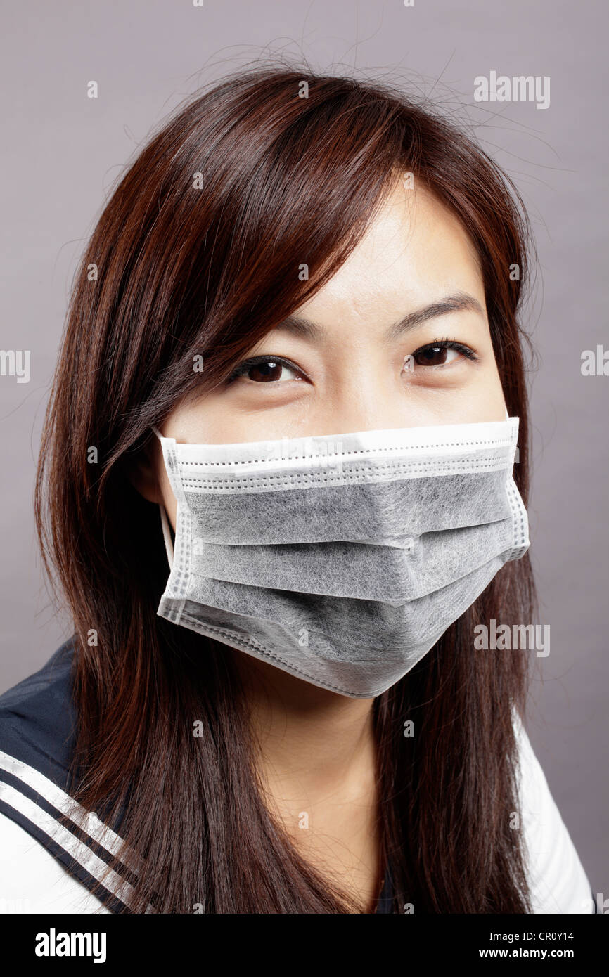Woman Cold Mask School girl has got cold and wear mask Stock Photo - Alamy