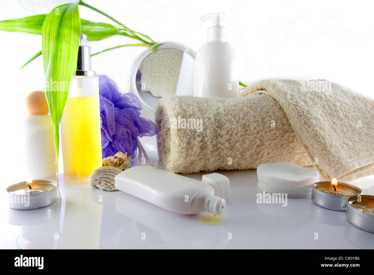 Composition of  messy cosmetics on the table with mirror Stock Photo