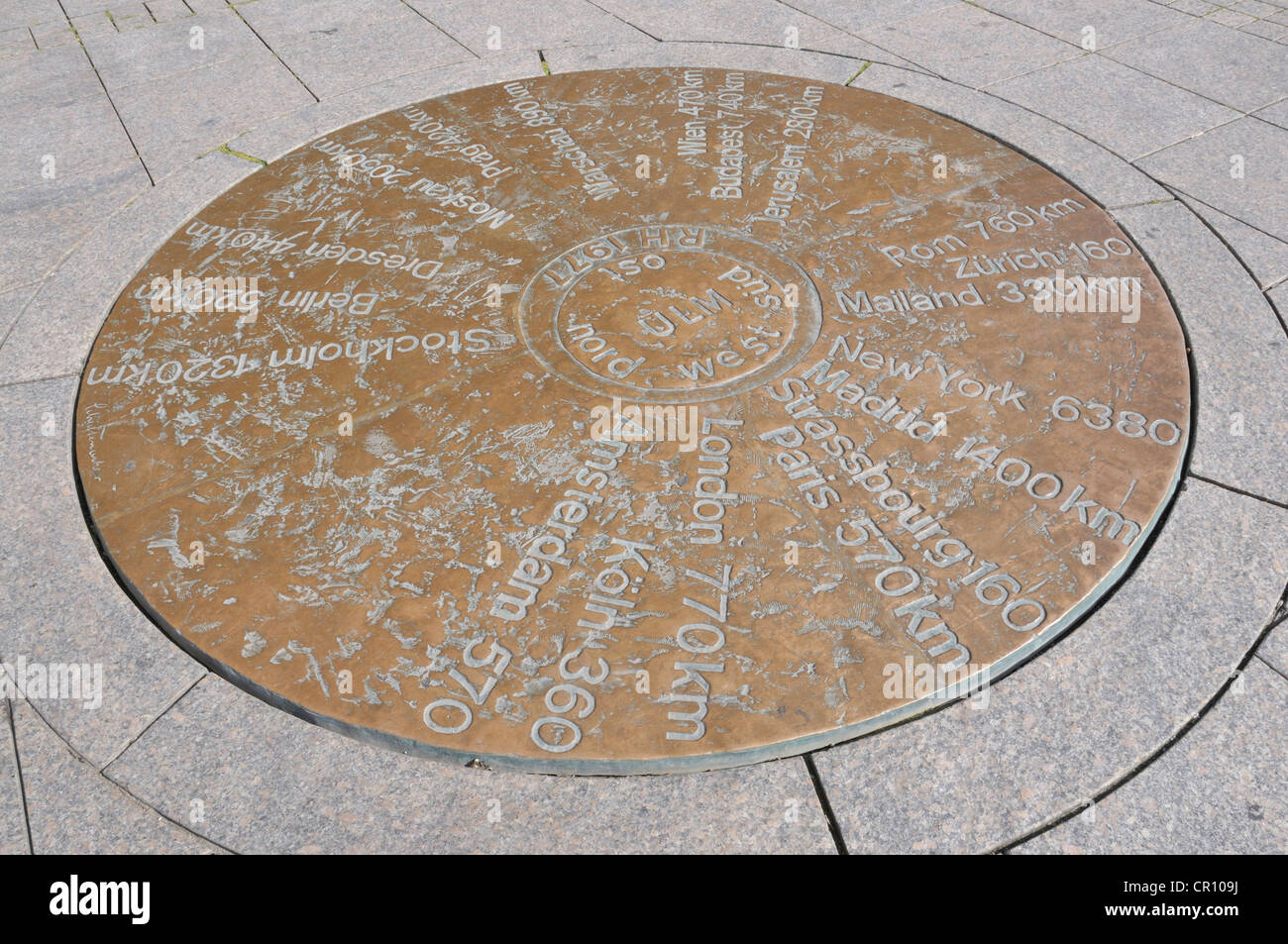 In Muensterplatz square a copper plate shows the distances to other towns, Ulm, Baden-Wuerttemberg, Germany, Europe Stock Photo