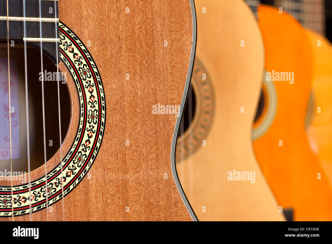 A lot of guitars in the store abstract background Stock Photo