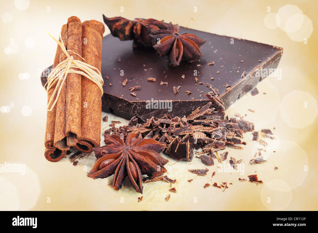 Chopped chocolate pieces, cinnamon sticks and anise Stock Photo
