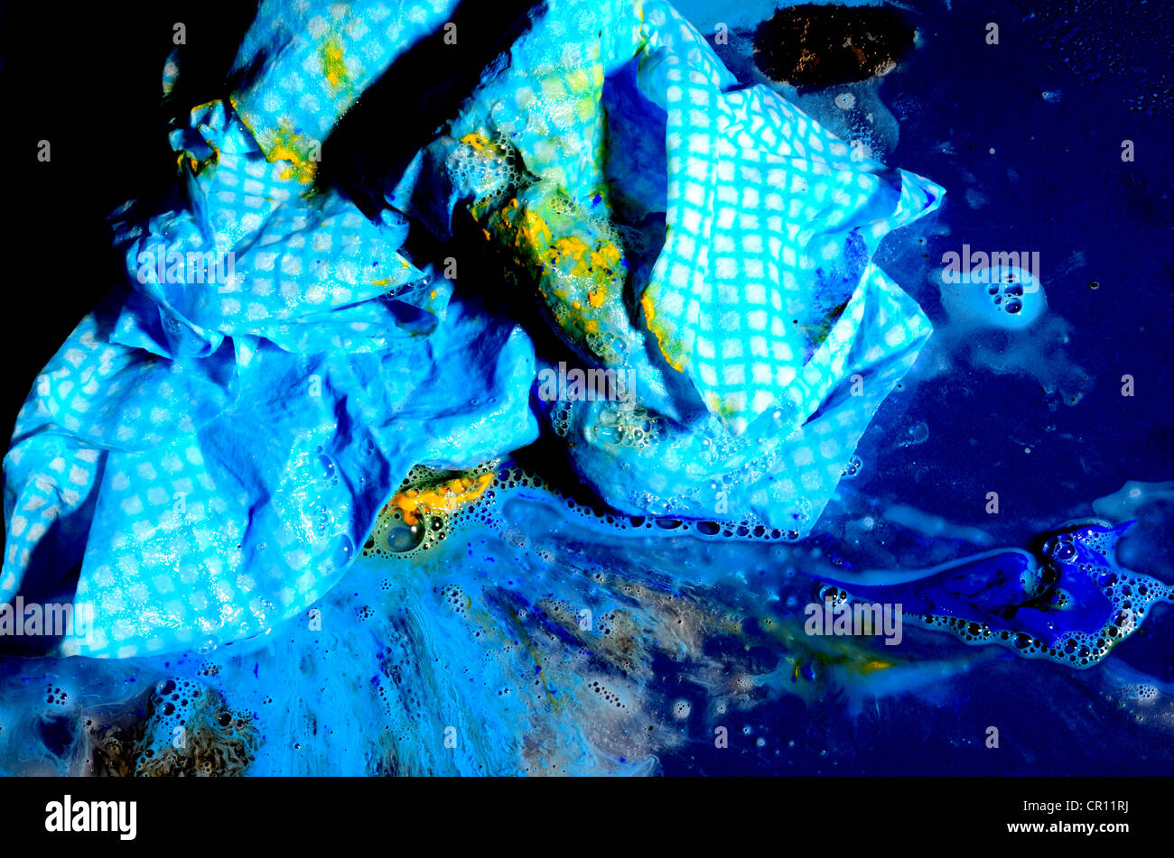 blue j cloth rag with blue and yellow paint Stock Photo - Alamy