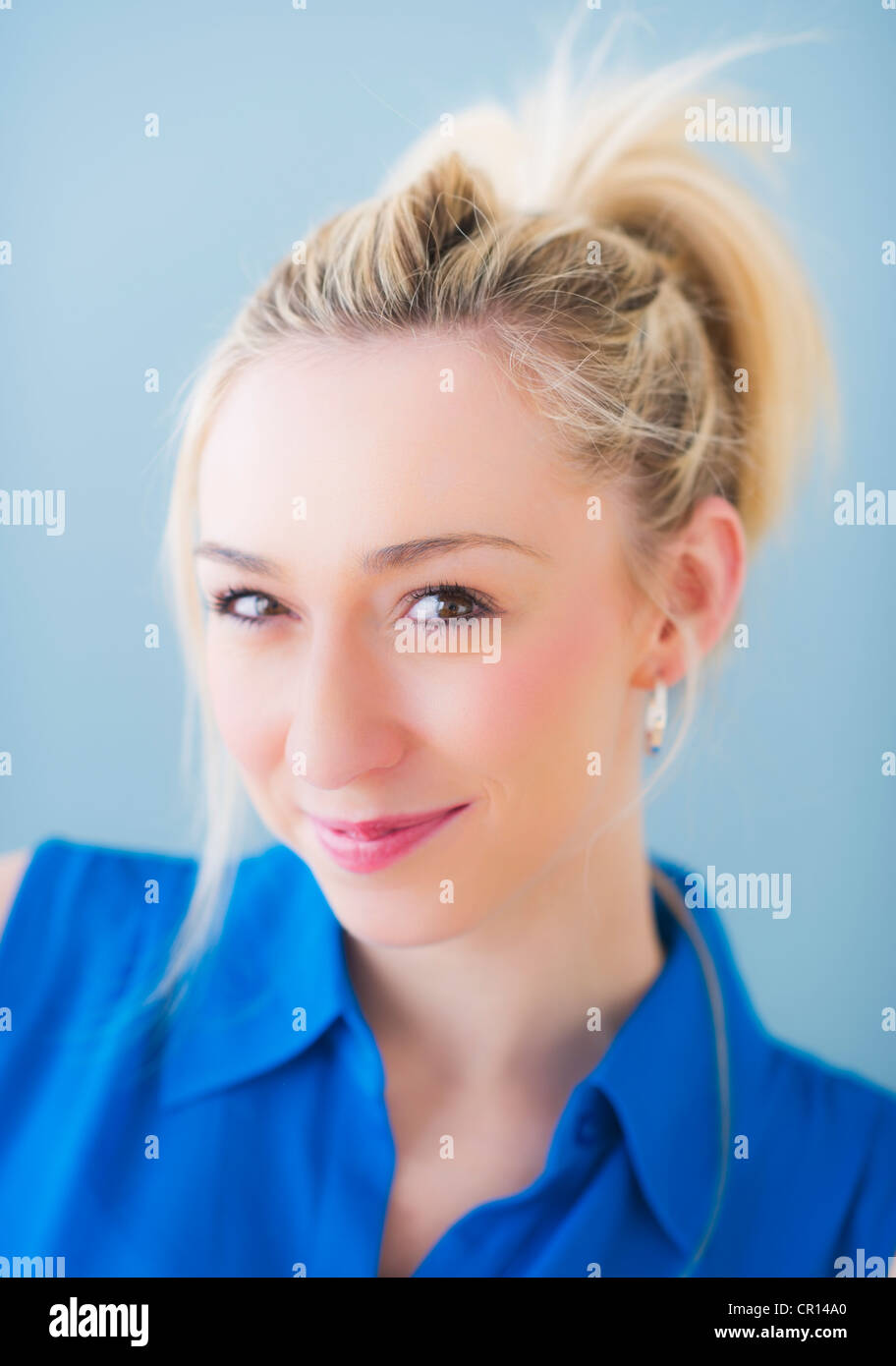Portrait of smiling young woman, studio shot Stock Photo - Alamy