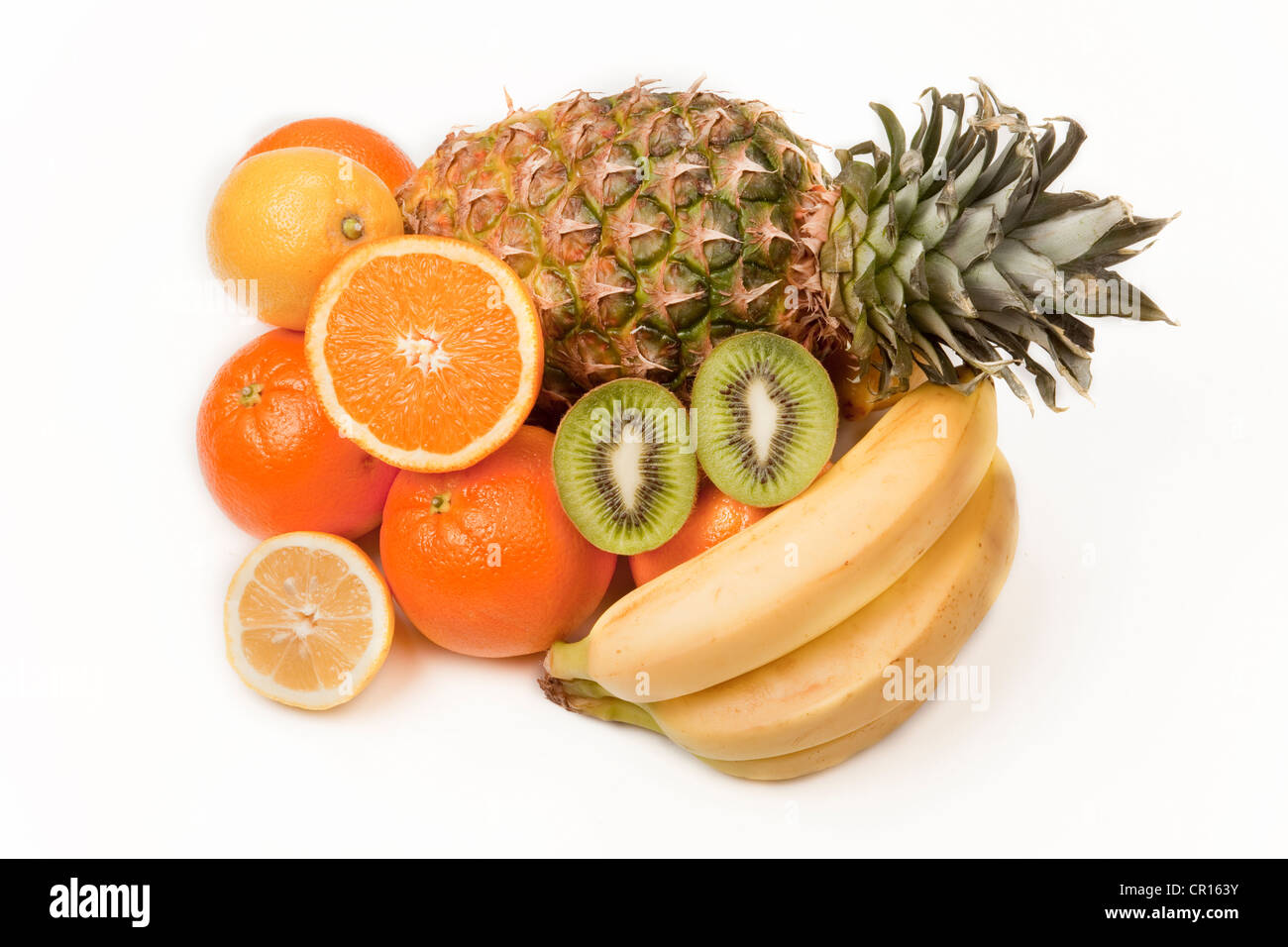 Assorted fruit, pineapple, kiwi fruit, oranges, lemon Stock Photo