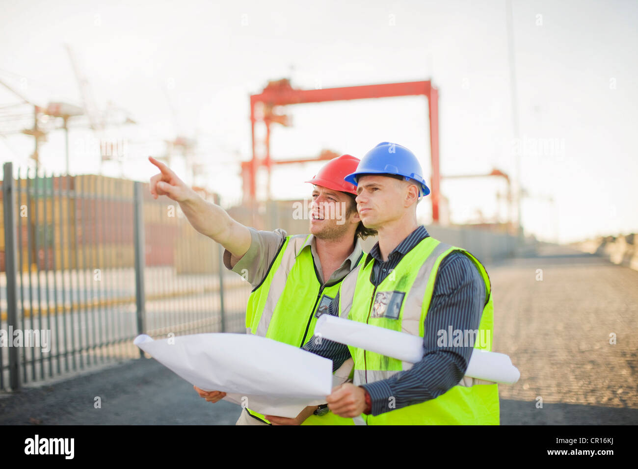 Construction workers talking on site Stock Photo