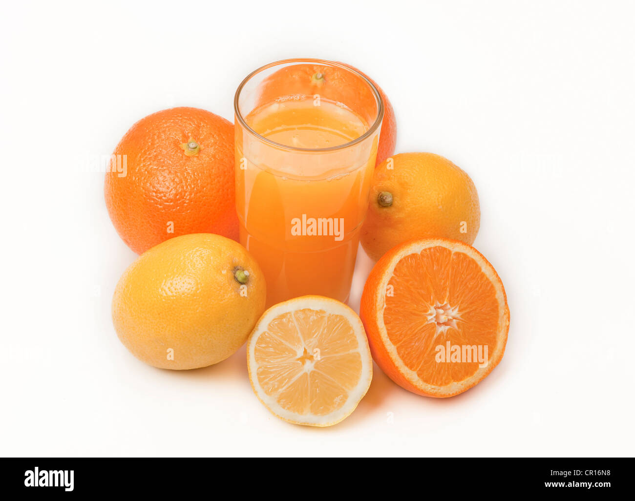 Oranges and lemons with a glass of orange juice Stock Photo