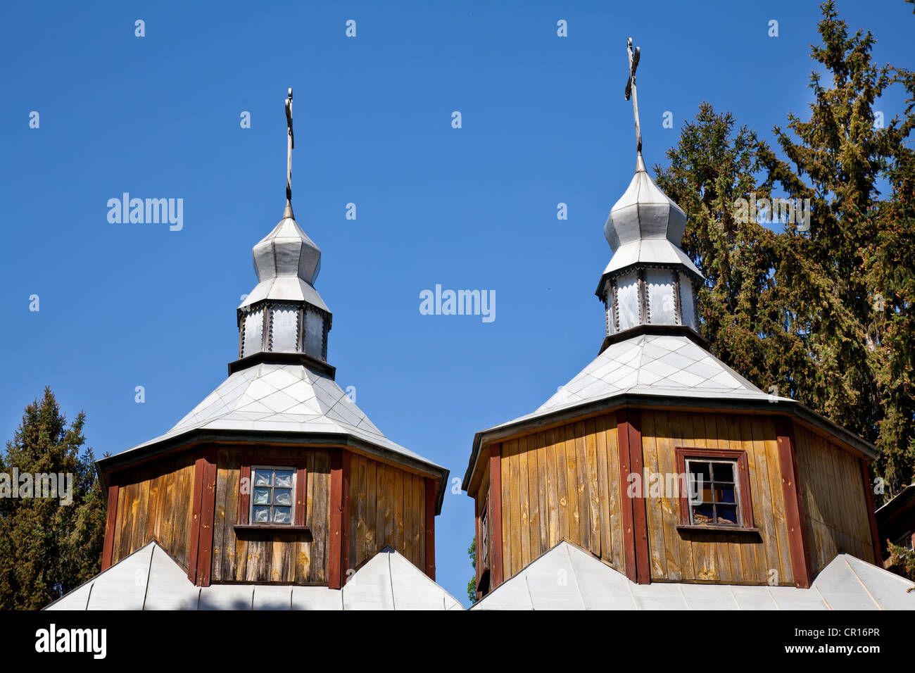 Two domes with crosses of wooden church Stock Photo