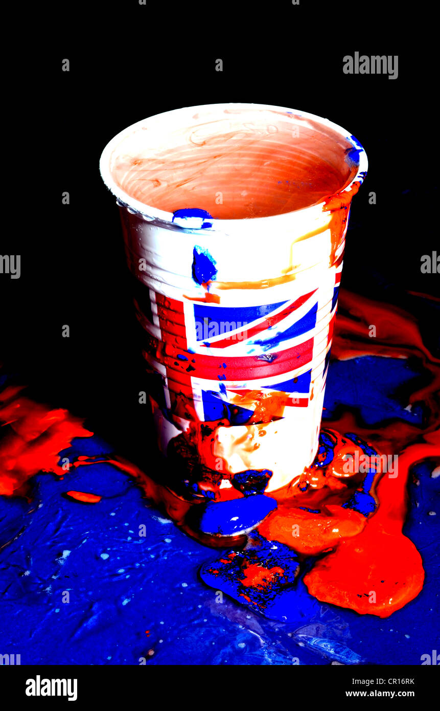 plastic cup with Union Jack flag logo and red and blue paint Stock Photo