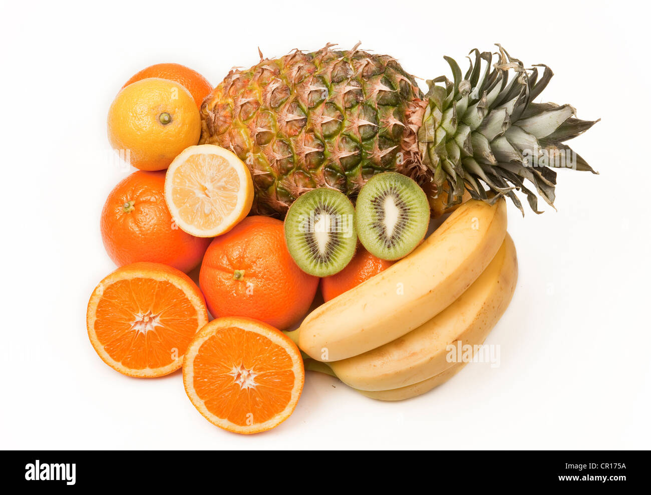Variety of fruits, a pineapple, a kiwi fruit, oranges, a lemon and bananas Stock Photo