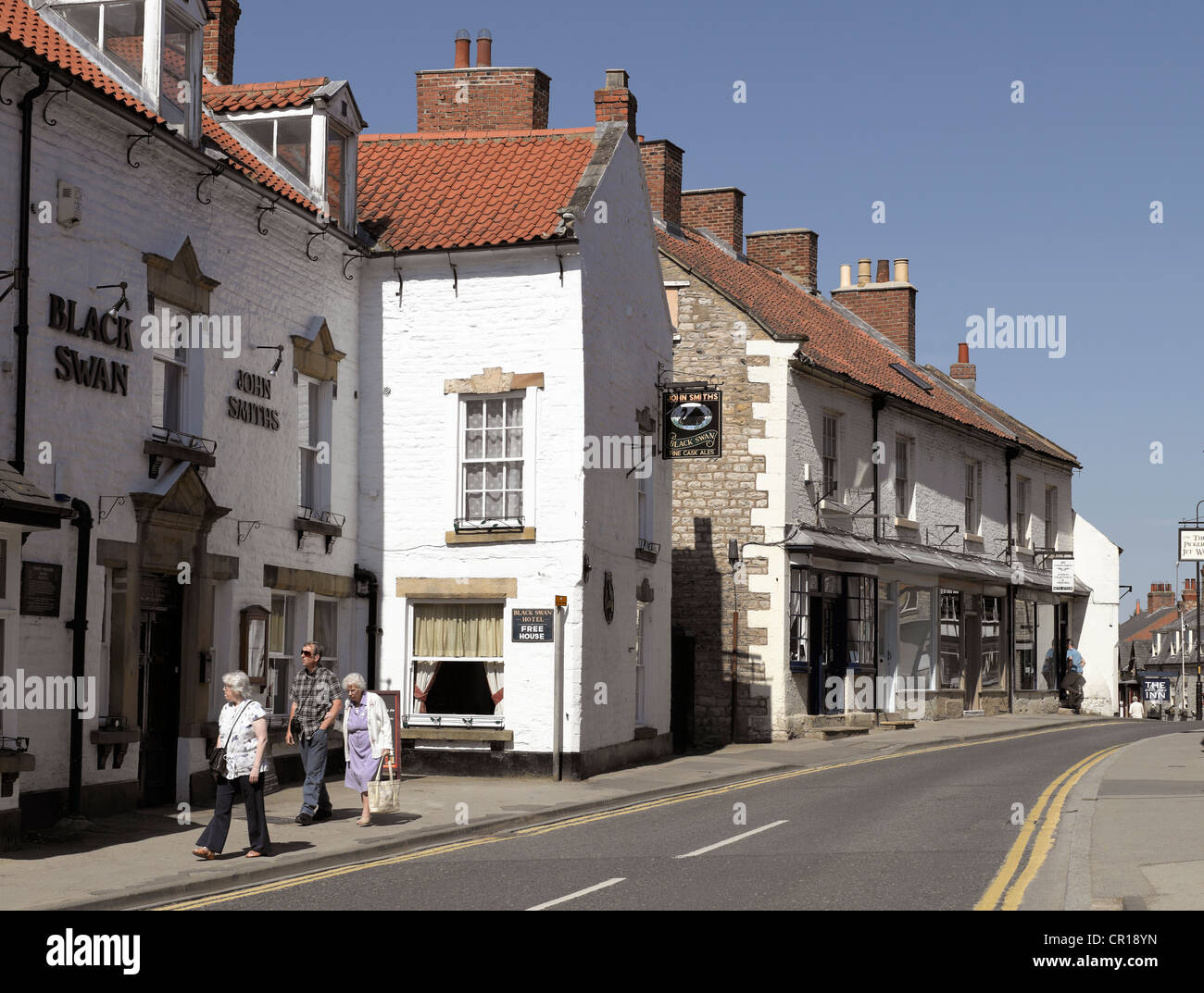 People walking in the town centre in summer Birdgate Pickering North Yorkshire England UK United Kingdom GB Great Britain Stock Photo