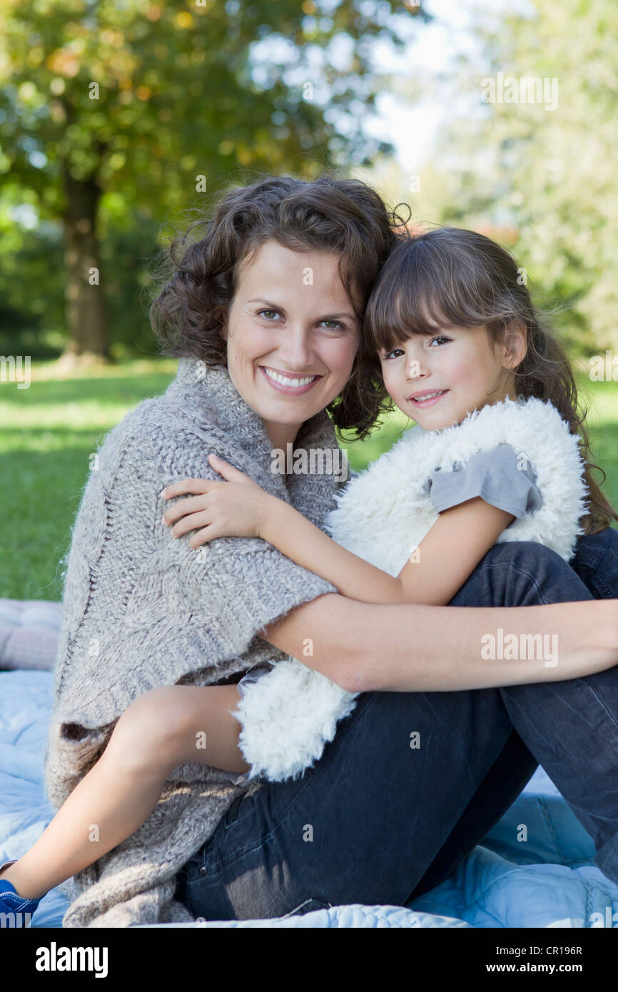 Mother and daughter relaxing on blanket Stock Photo Alamy
