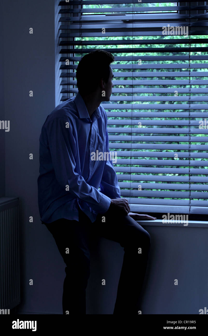 Lonely Man Looking Out Of Window Stock Photos Lonely Man