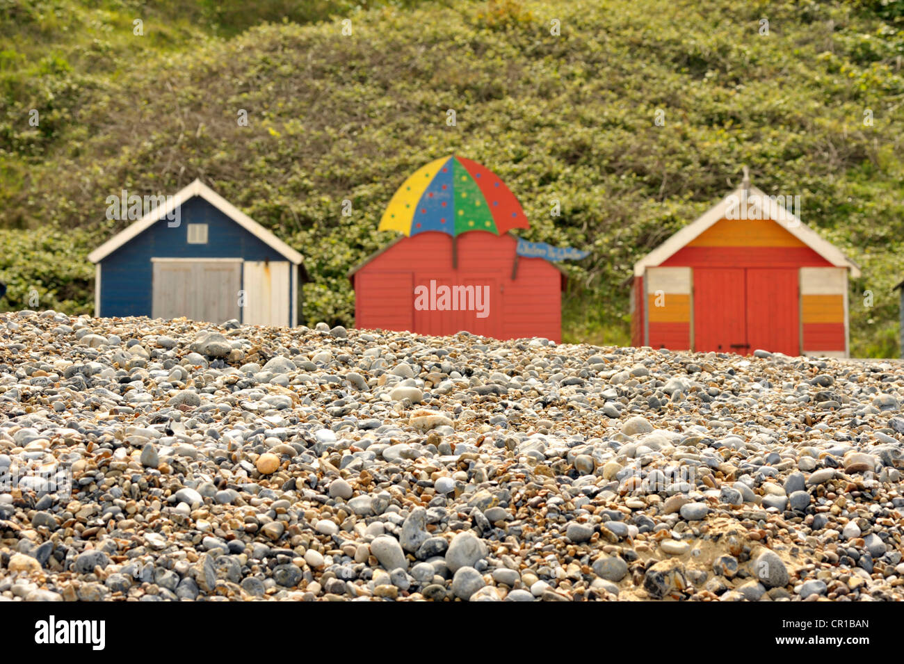 Traditional seaside beach huts along Cromer's East beach in North Norfolk Stock Photo
