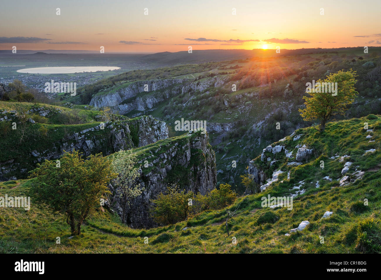 A vibrant spring sunset photographed from the Pinnacles at the top of Cheddar Gorge, Somerset, UK. Stock Photo