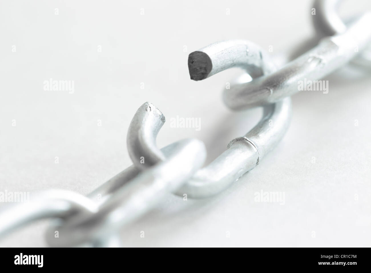 Steel chain with an open link, symbolic image for 'a chain is only as strong as its weakest link' Stock Photo