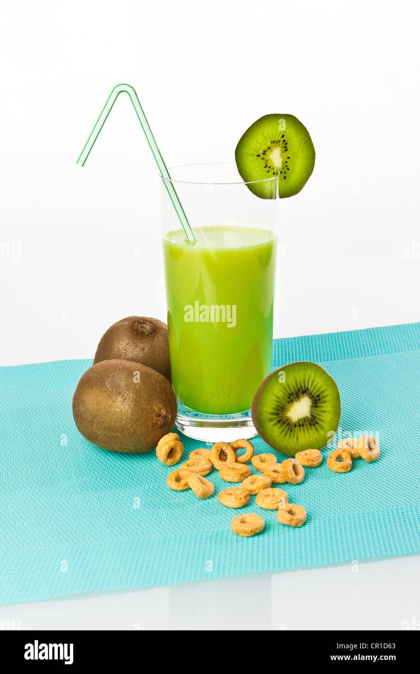 Kiwi fruit drinking yoghurt, kiwi shake in a glass with kiwi fruit and