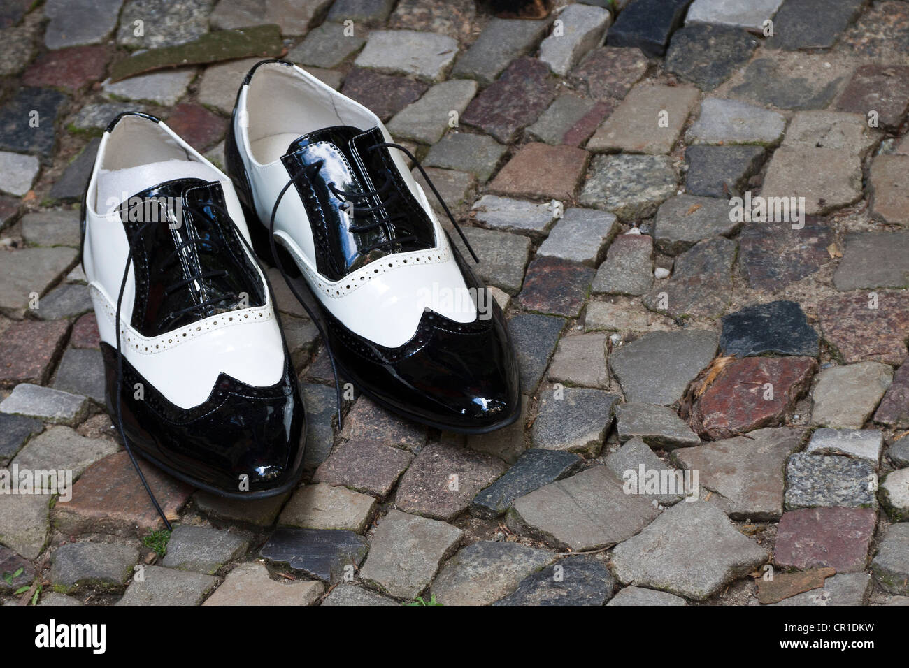 Men's patent leather shoes on cobblestones, Berlin, Germany, Europe
