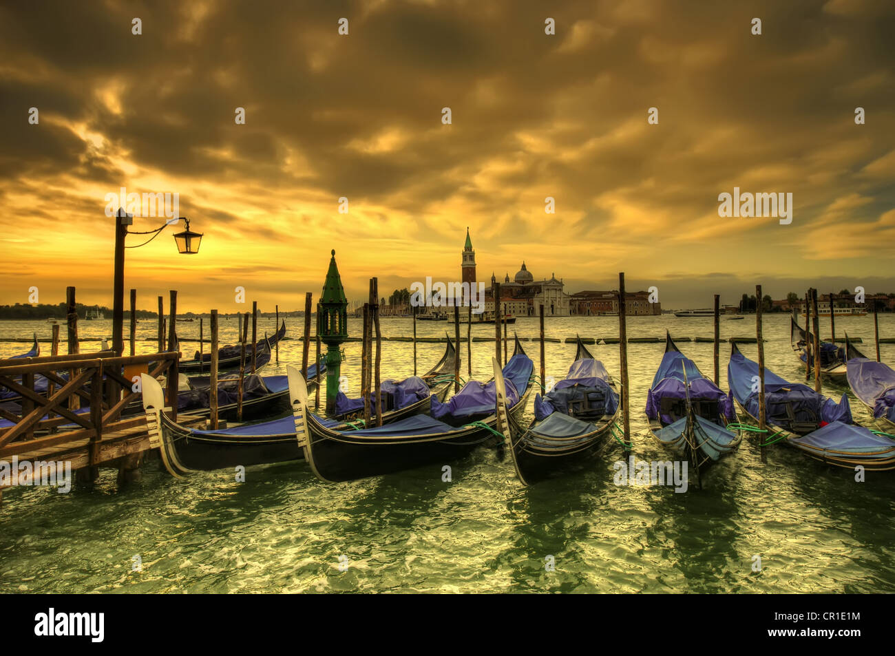 Venice dramatic scene with gondolas at sunset, Italy Stock Photo - Alamy