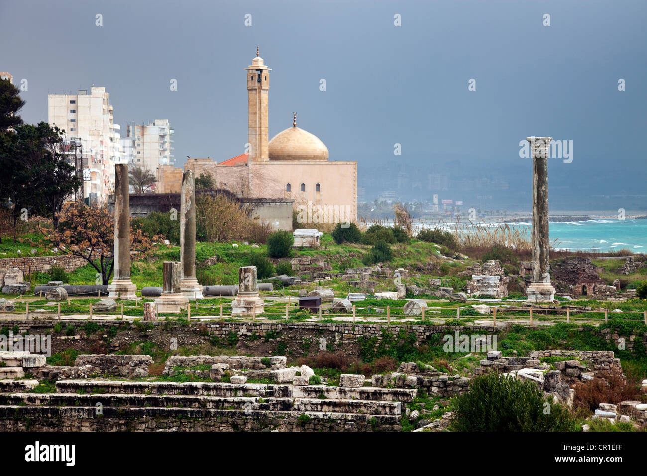 Lebanon, Tyre, Al Mina ruins, mosque in background Stock Photo