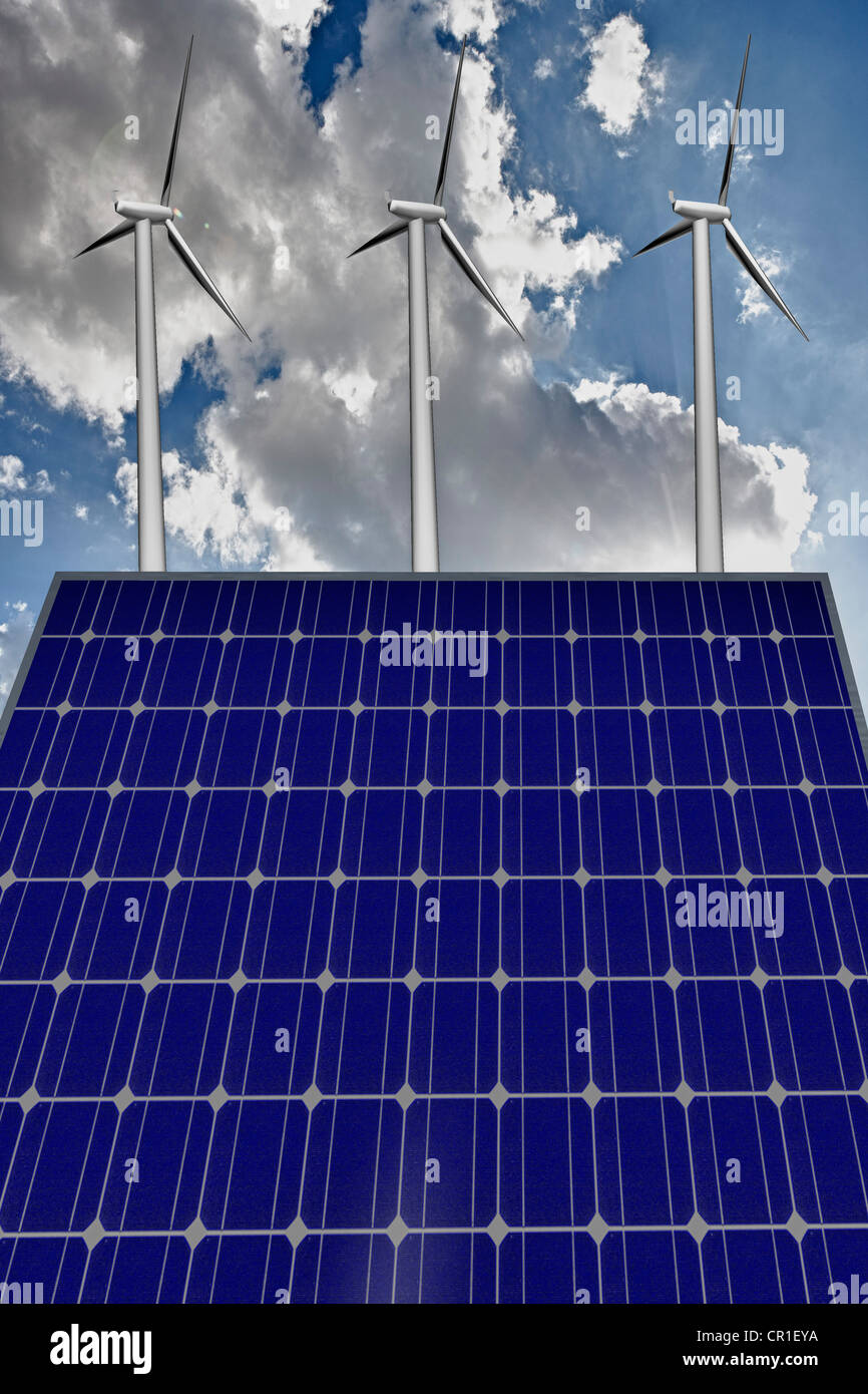 Wind turbines and a solar panel against a blue sky with clouds Stock ...