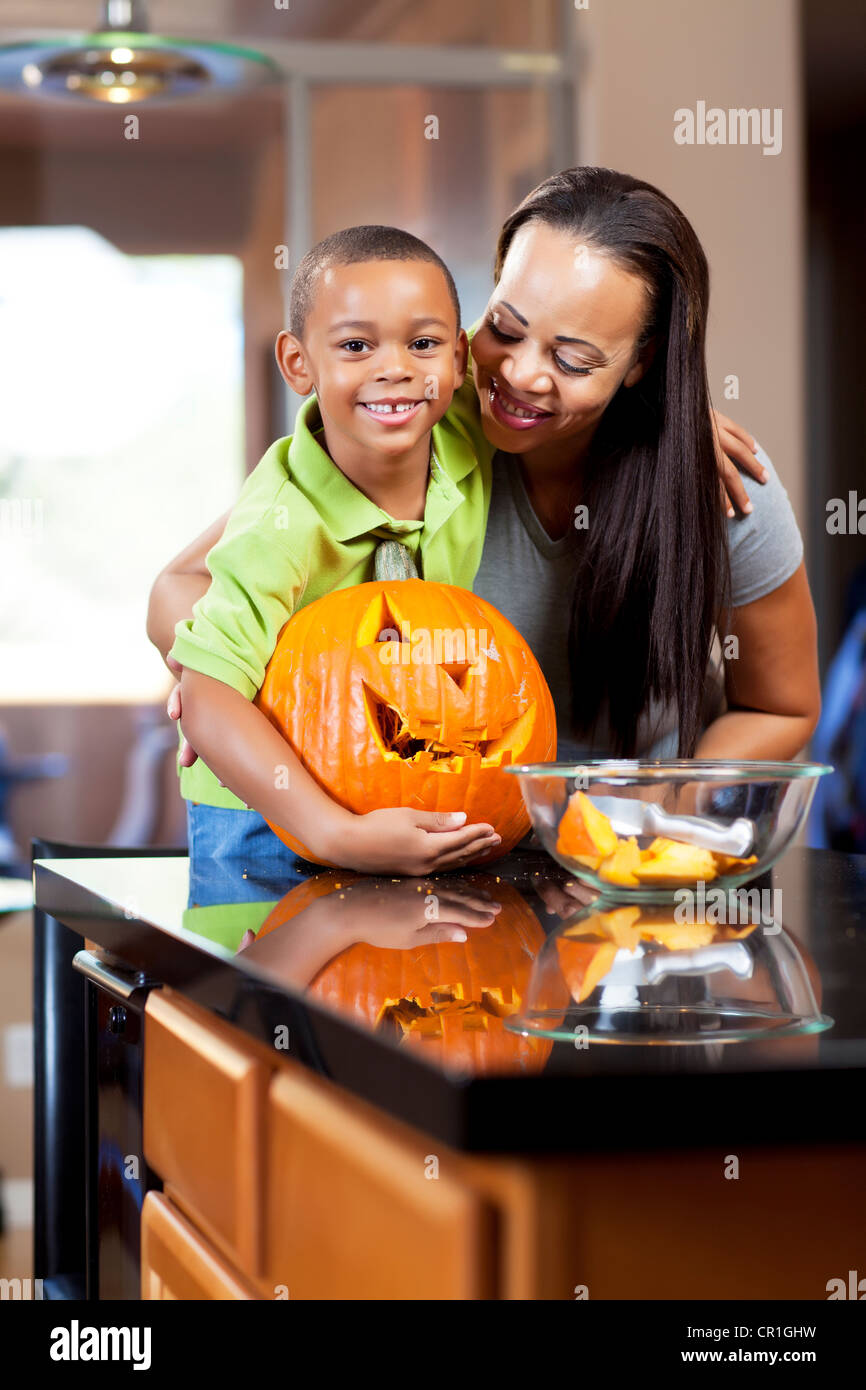 Mother and son carving jack-o-lantern Stock Photo - Alamy