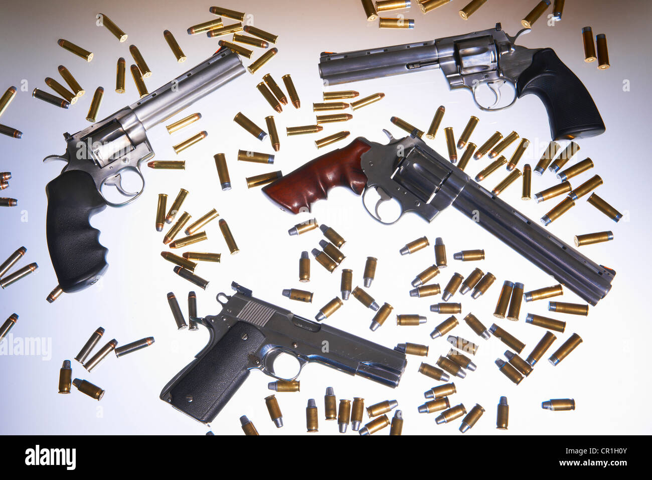 Various handguns and bullets Stock Photo