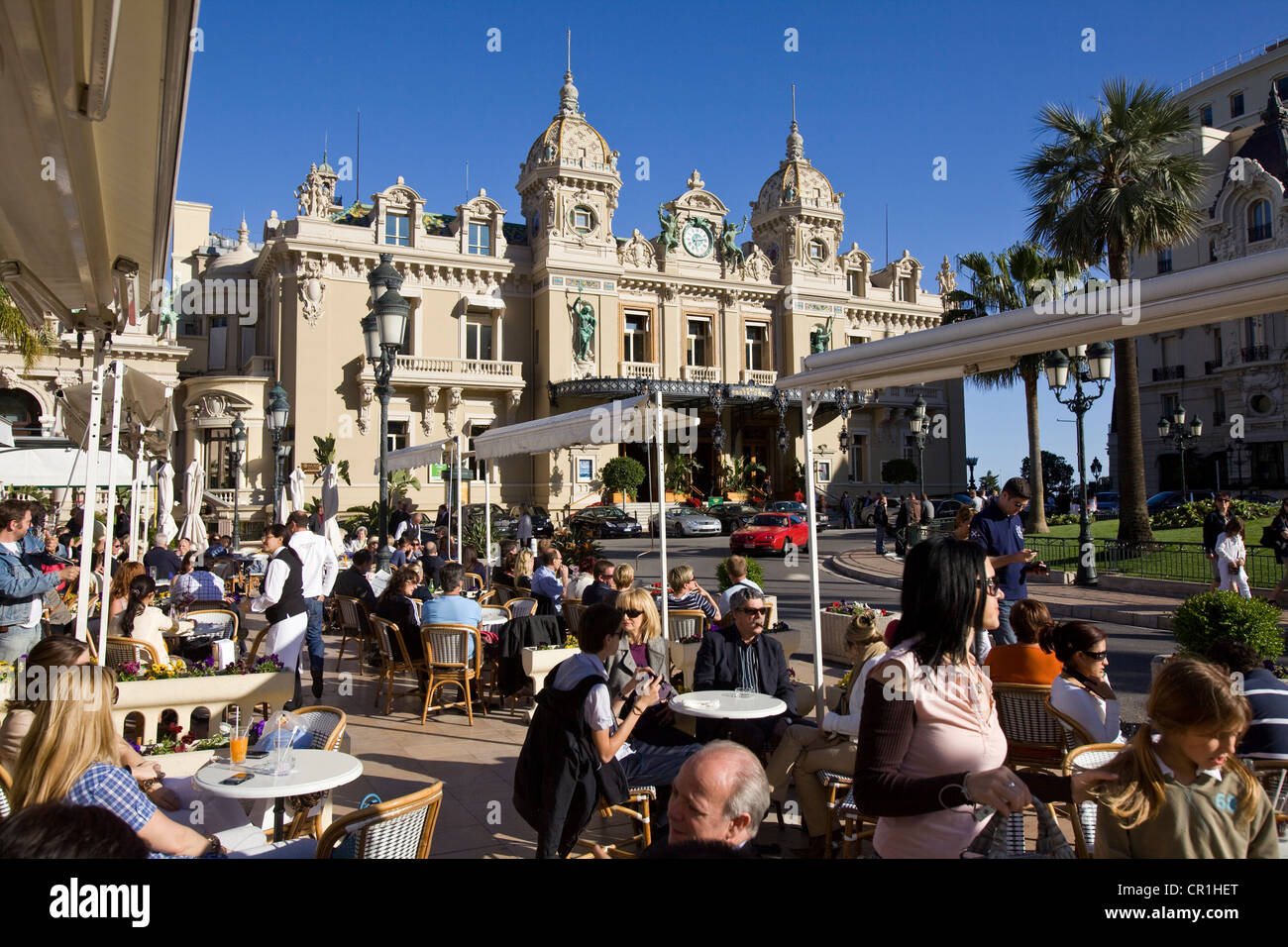 Principalty of Monaco, Monaco, Monte Carlo, Place du Casino and terrace of Cafe de Paris, property of the Societe des Bains de Stock Photo