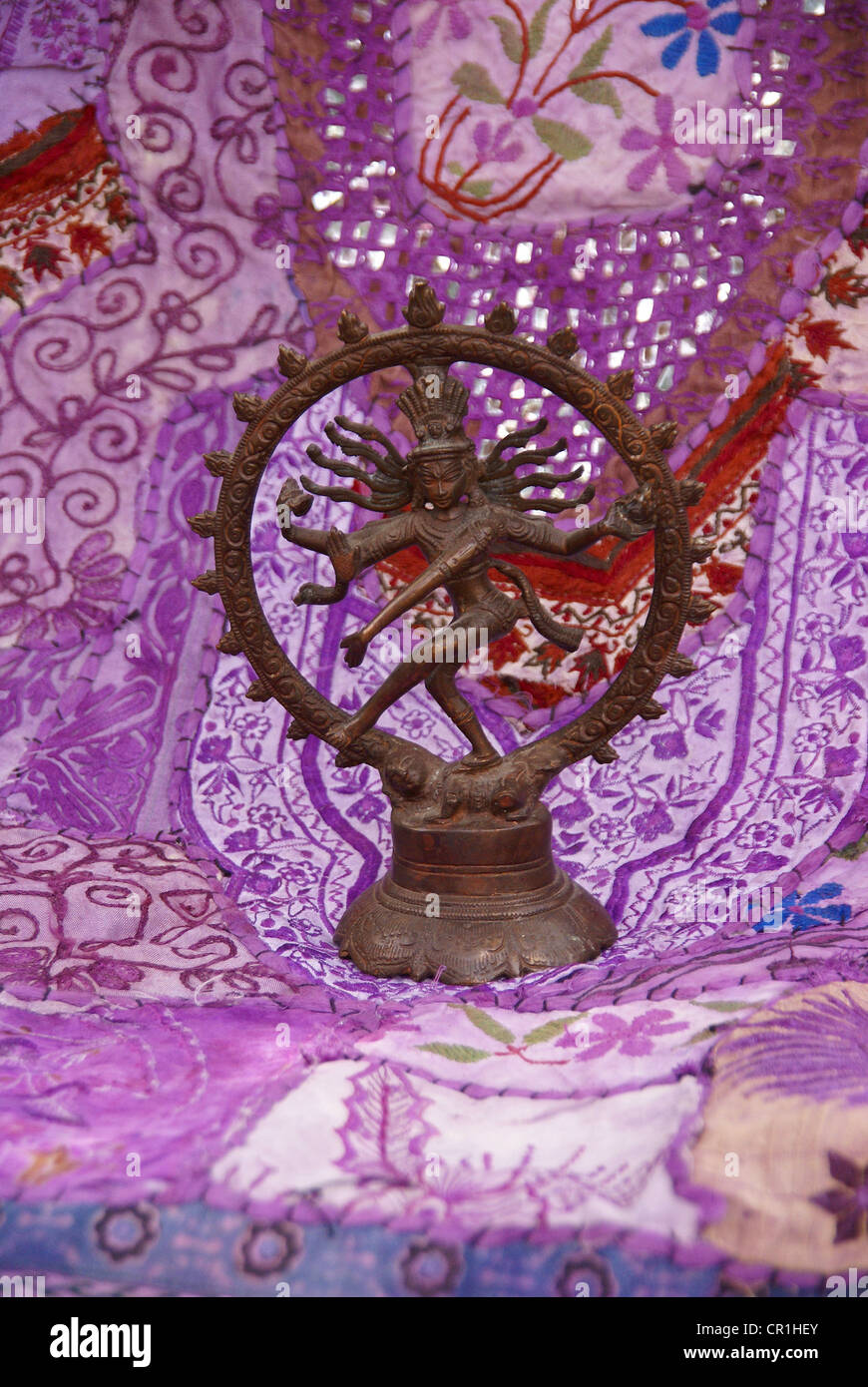 Bronze Shiva  Rajasthani textile backdrop made from saris.  Nataraja (Sanskrit: Lord of Dance) Shiva represe Stock Photo