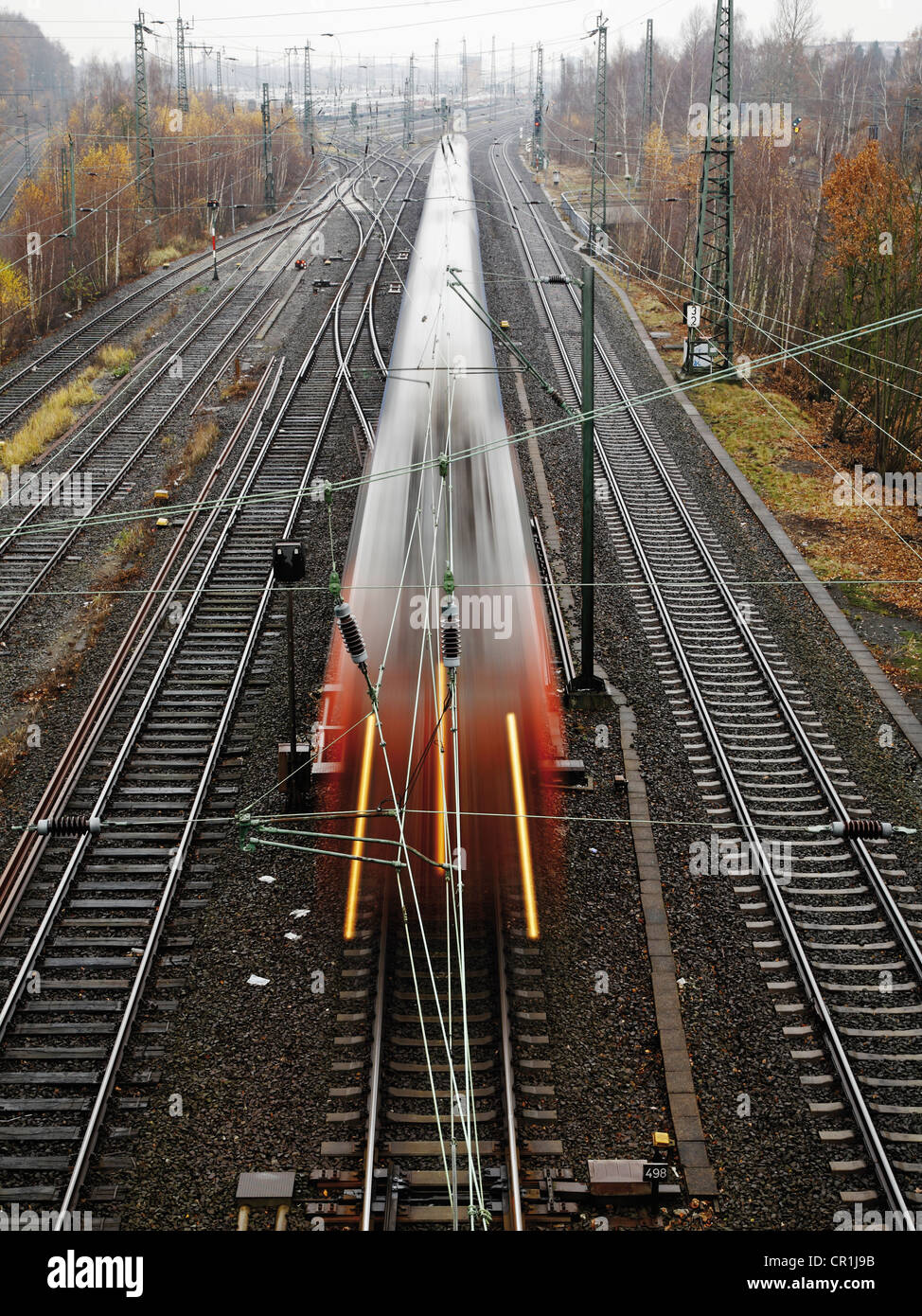 Train in motion, public transportation, railroad track Stock Photo