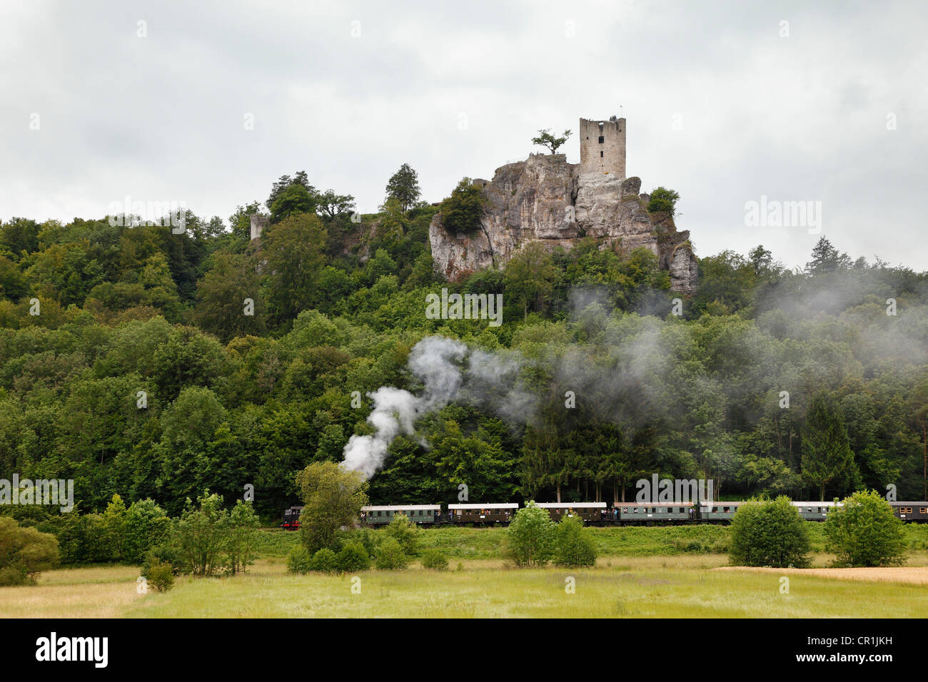 Ruins of Neideck Castle in Wiesenttal, with a historic steam train passing, Franconian Switzerland, Upper Franconia, Franconia Stock Photo