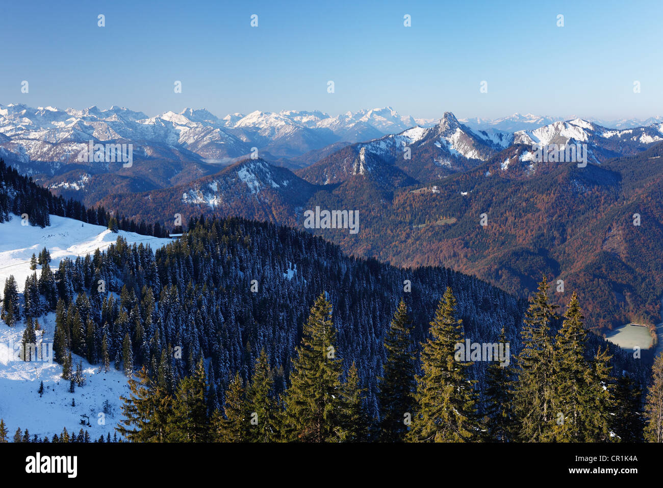 View from Mt Wallberg towards southwest, with mountains Rossstein and Buchstein at back and Mt Zugspitze behind, Upper Bavaria Stock Photo