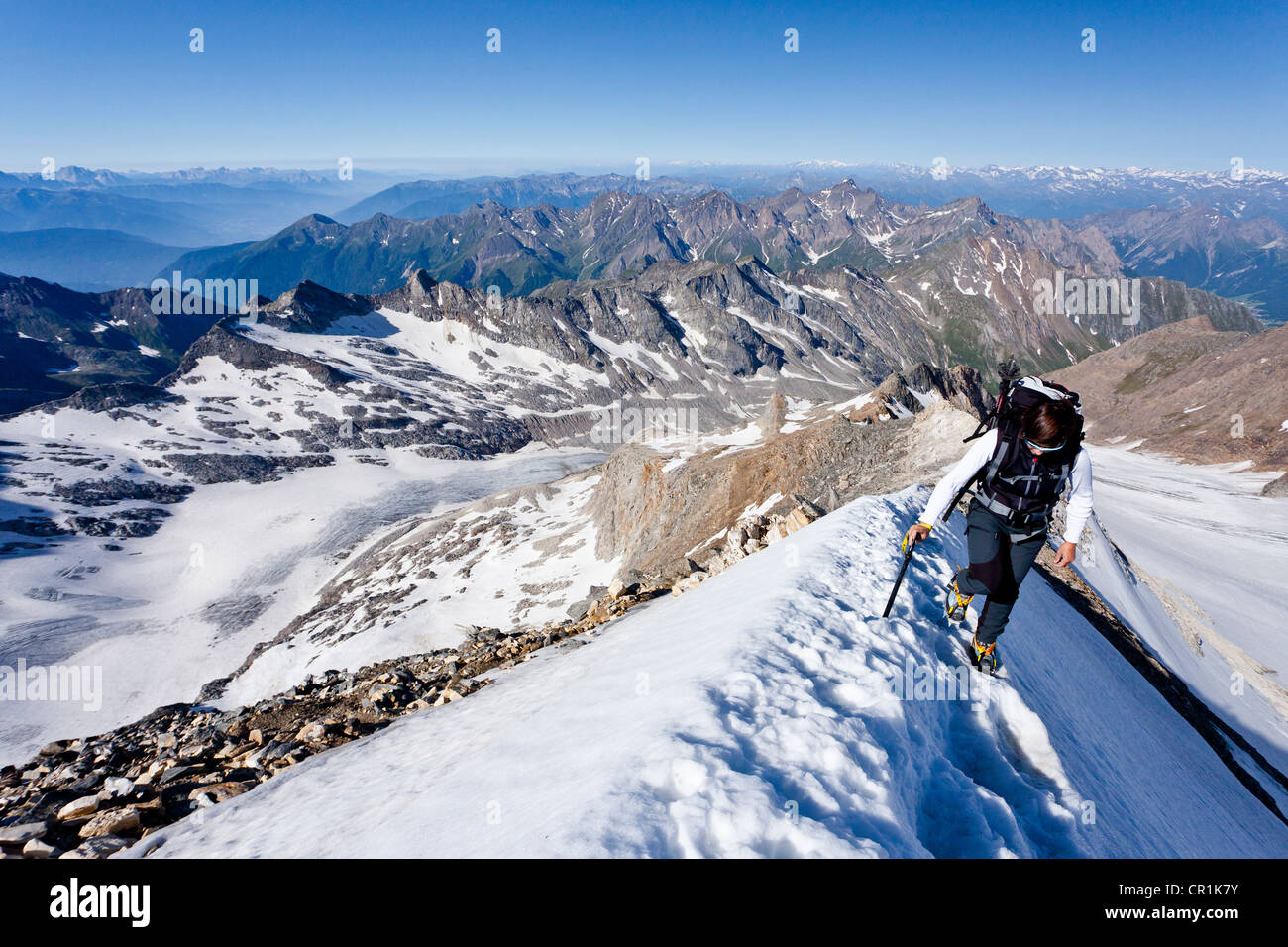 Mountaineer during the ascent to Mt Hochfeiler, Pfitschertal valley, Eisack valley and Wipptal valley at back, South Tyrol Stock Photo