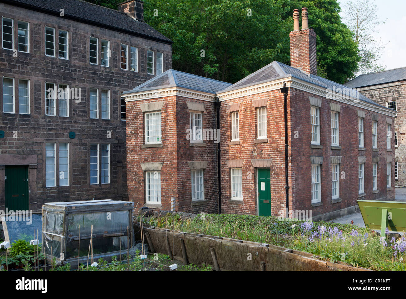 Brick cottage and former loom shop, Cromford Mill, Cromford - Richard Arkwright's former water-powered cotton spinning mill Stock Photo