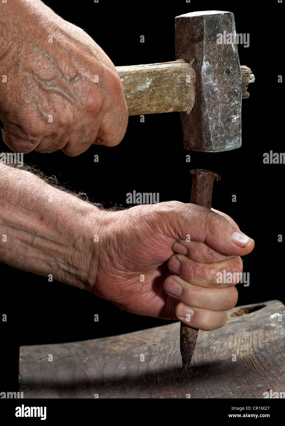 Carpenter is working with an old hammer and wedge Stock Photo Alamy